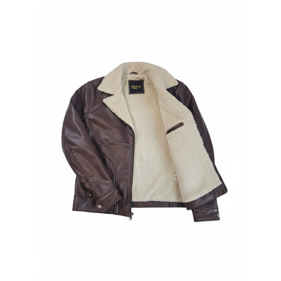 Interior view of Noayle Pro leather jacket showing soft cream shearling lining and inside pocket.